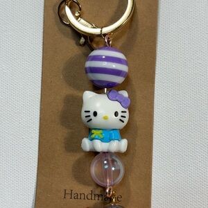 Cute Hello Kitty Keychain with Purple Accents